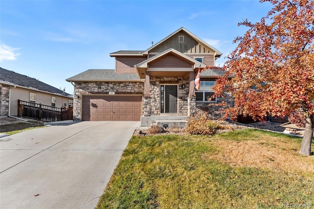 craftsman house with a garage and a front lawn