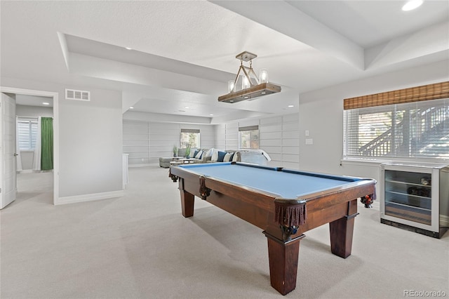 playroom with light carpet, visible vents, a raised ceiling, wine cooler, and pool table