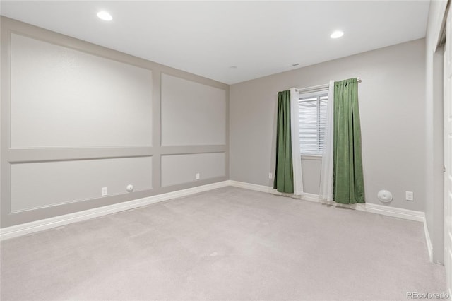 unfurnished room featuring carpet, baseboards, and recessed lighting