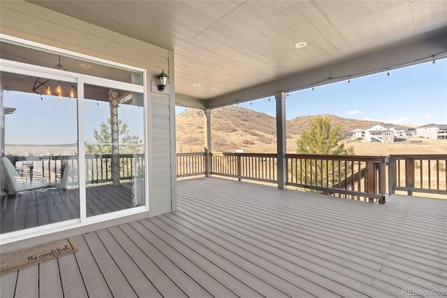 wooden terrace featuring a mountain view