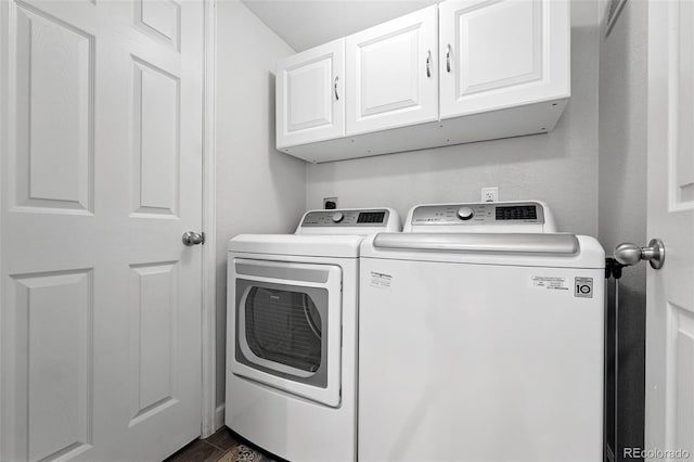 10010 E Gunnison Pl Unit 707, Aurora, CO 80247 - washroom with separate washer and dryer, cabinet space, and dark wood finished floors