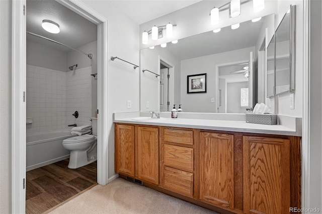 10010 E Gunnison Pl Unit 707, Aurora, CO 80247 - bathroom with toilet, double vanity, bathing tub / shower combination, and ceiling fan