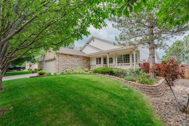 10877 W 55th Ln, Arvada, CO 80002 - view of front of property with stone siding, a porch, an attached garage, a front lawn, and concrete driveway