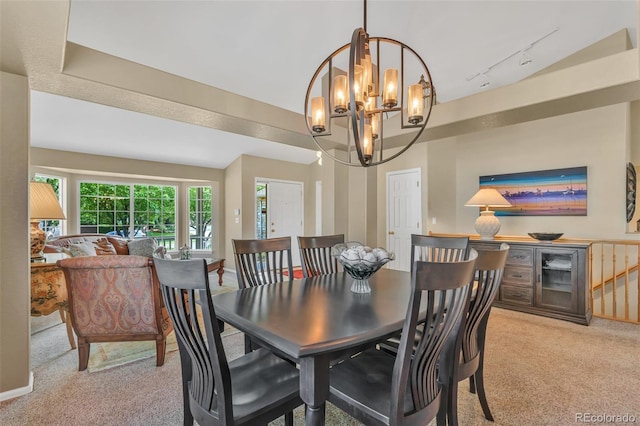 10877 W 55th Ln, Arvada, CO 80002 - dining area featuring carpet, a chandelier, and track lighting