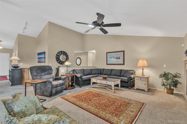 10877 W 55th Ln, Arvada, CO 80002 - carpeted living area with vaulted ceiling, a ceiling fan, rail lighting, and baseboards