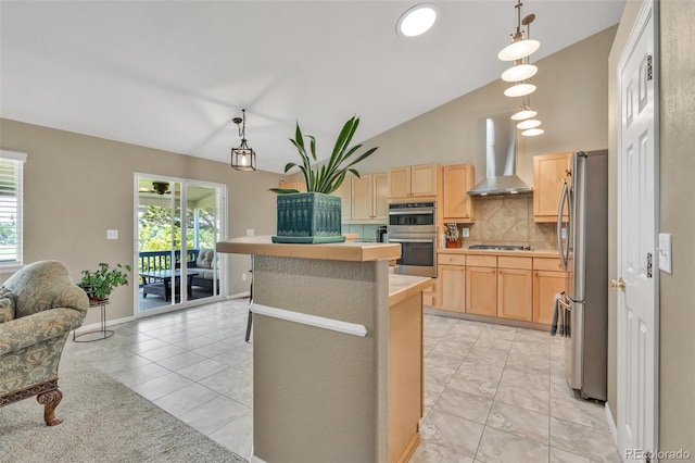 10877 W 55th Ln, Arvada, CO 80002 - kitchen featuring wall chimney exhaust hood, appliances with stainless steel finishes, light brown cabinetry, vaulted ceiling, and decorative backsplash