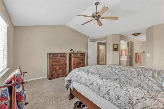 10877 W 55th Ln, Arvada, CO 80002 - bedroom with light colored carpet, vaulted ceiling, a ceiling fan, baseboards, and ensuite bath