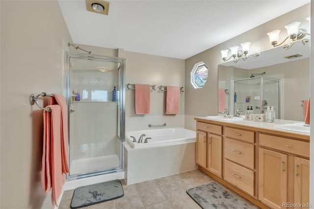 10877 W 55th Ln, Arvada, CO 80002 - bathroom with a shower stall, a bath, double vanity, and tile patterned flooring