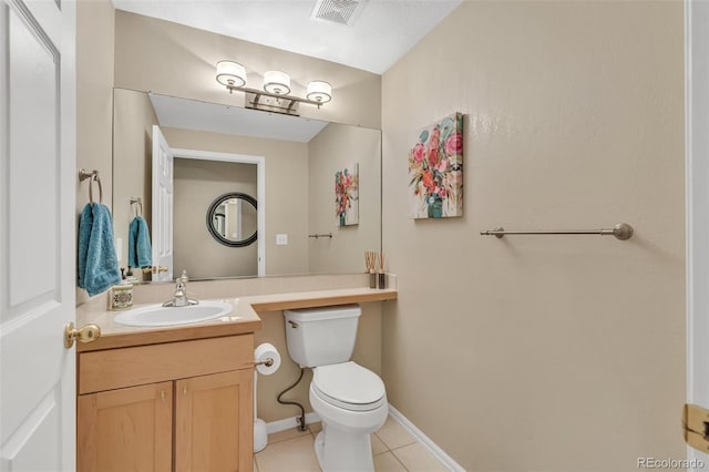 10877 W 55th Ln, Arvada, CO 80002 - bathroom with tile patterned flooring, vanity, toilet, and baseboards