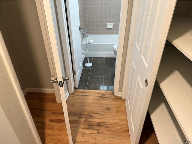 8307 E 14th Ave, Denver, CO 80220 - full bathroom with toilet and wood finished floors