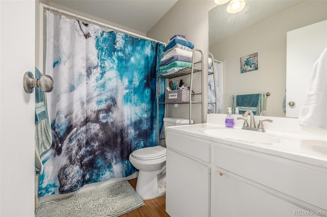 2281 S Vaughn Way Unit 316A, Aurora, CO 80014 - full bath featuring vanity, toilet, wood finished floors, and a shower with curtain