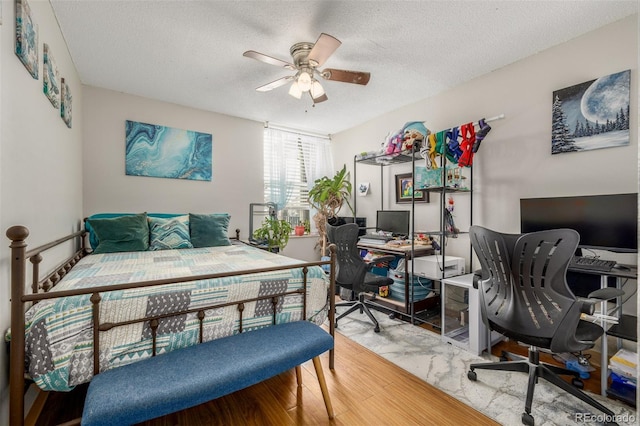 2281 S Vaughn Way Unit 316A, Aurora, CO 80014 - bedroom featuring a textured ceiling and an office area