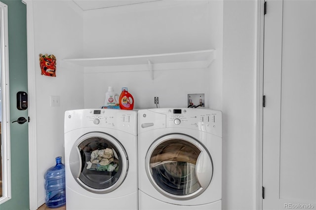 laundry area featuring laundry area and washing machine and dryer