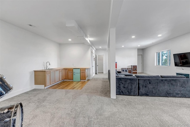 living room featuring recessed lighting, visible vents, light colored carpet, and baseboards