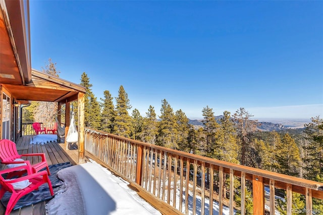 deck featuring a forest view