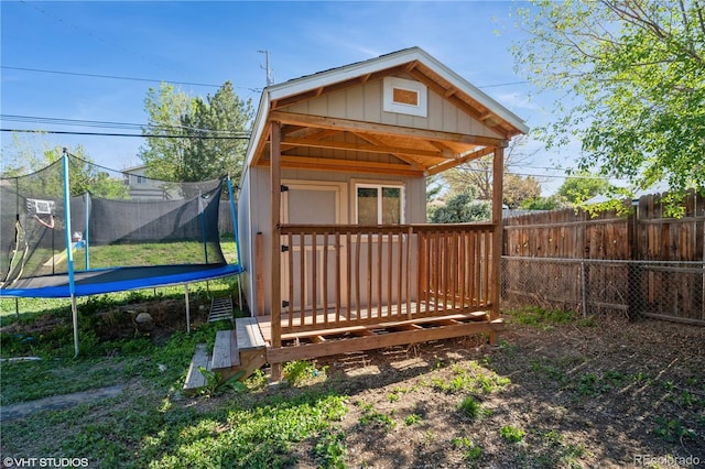 2080 E 84th Ave, Denver, CO 80229 - view of outbuilding featuring a trampoline, a fenced backyard, and an outbuilding