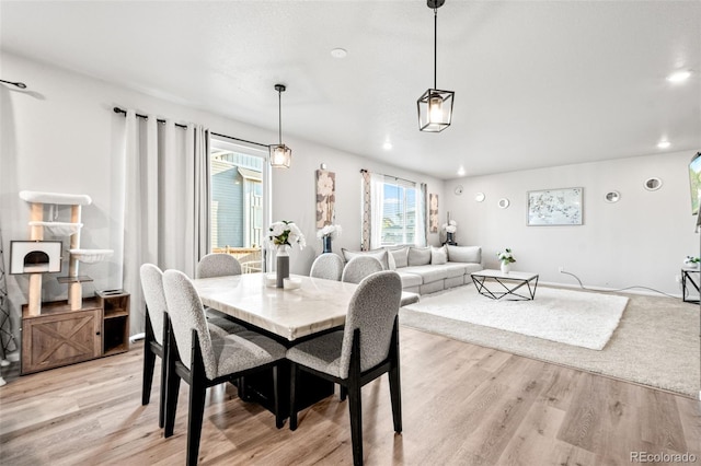 3074 Kestrel St, Brighton, CO 80601 - dining space with light wood-style flooring and recessed lighting