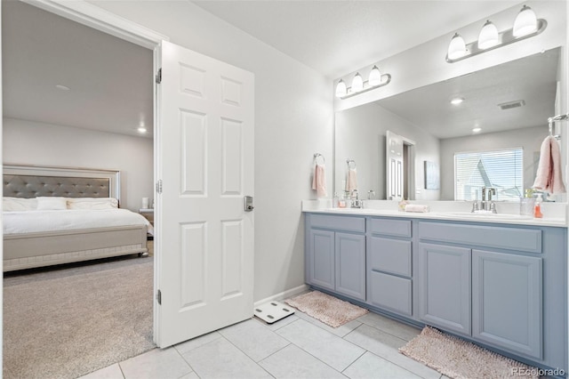 3074 Kestrel St, Brighton, CO 80601 - ensuite bathroom with double vanity and tile patterned floors