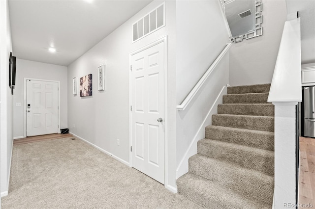 3074 Kestrel St, Brighton, CO 80601 - staircase featuring carpet floors and baseboards