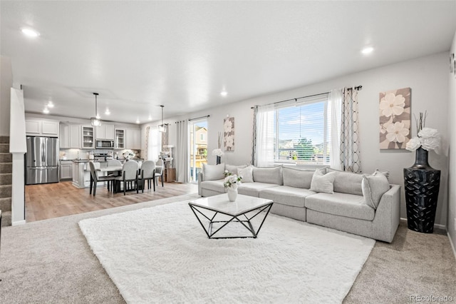 3074 Kestrel St, Brighton, CO 80601 - living room featuring recessed lighting and light carpet