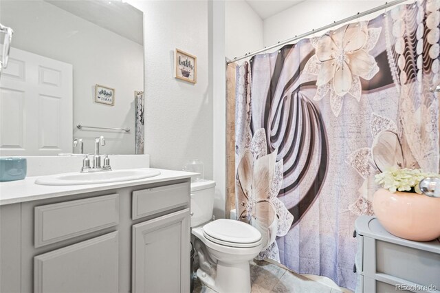 3074 Kestrel St, Brighton, CO 80601 - bathroom with vanity and a shower with shower curtain