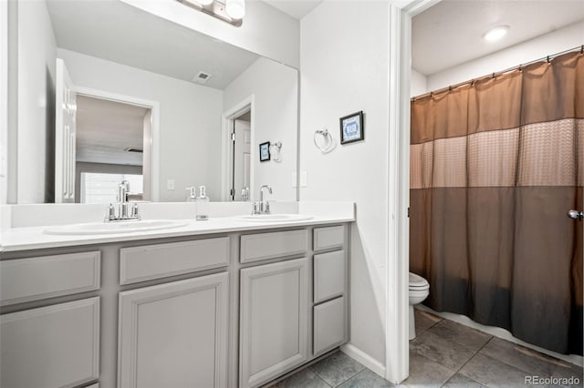 3074 Kestrel St, Brighton, CO 80601 - bathroom featuring double vanity, tile patterned flooring, and a shower with curtain
