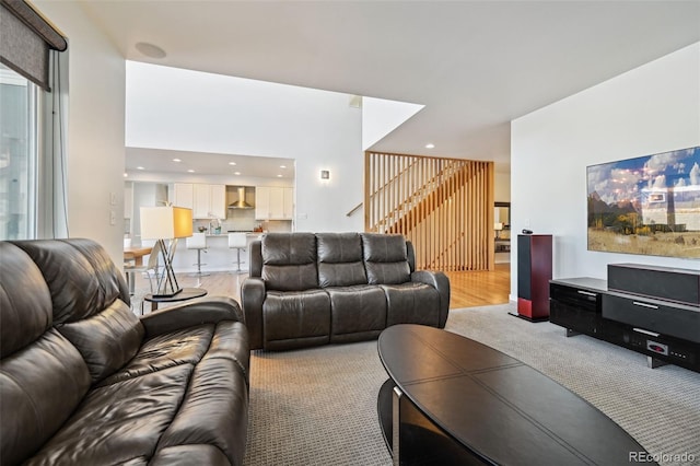 living room with light wood-type flooring and plenty of natural light