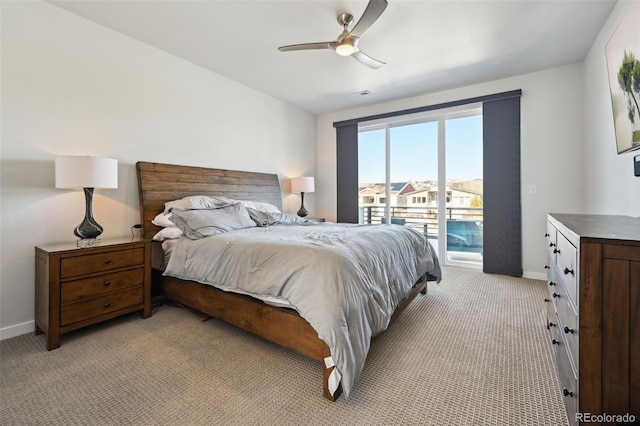 bedroom with access to outside, light colored carpet, and ceiling fan