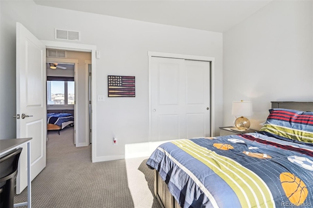 carpeted bedroom featuring a closet