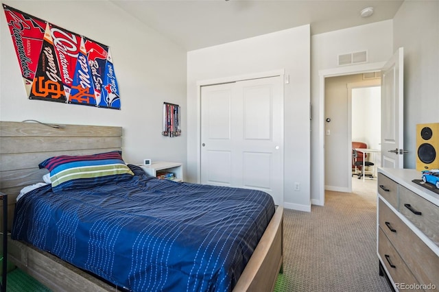 carpeted bedroom with a closet