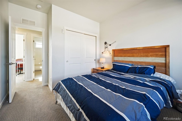 carpeted bedroom with a closet