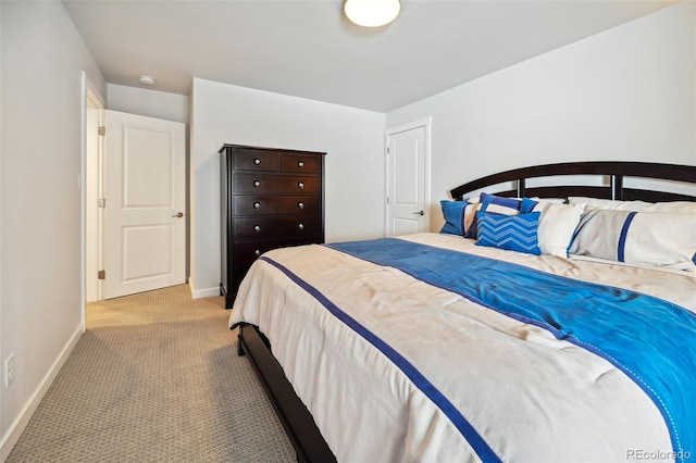 bedroom featuring light carpet