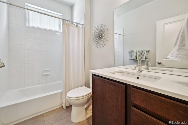 full bathroom featuring tile patterned flooring, vanity, shower / tub combo, and toilet