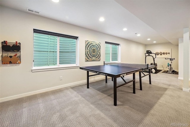 recreation room featuring plenty of natural light and light colored carpet