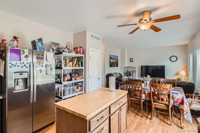 9615 Lansing Cir, Commerce City, CO 80022 - kitchen with stainless steel fridge with ice dispenser, visible vents, a ceiling fan, wood counters, and open floor plan