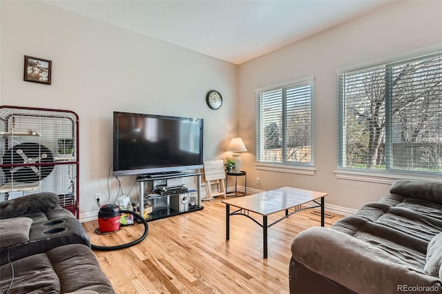 9615 Lansing Cir, Commerce City, CO 80022 - living area with baseboards and wood finished floors