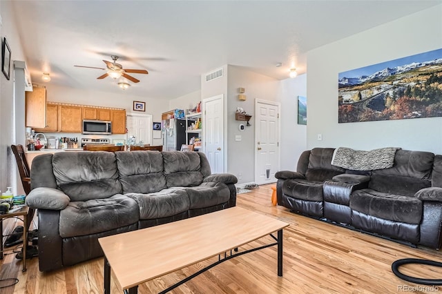 9615 Lansing Cir, Commerce City, CO 80022 - living room with a ceiling fan, visible vents, and light wood-style flooring