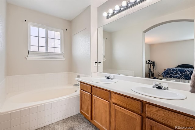 9615 Lansing Cir, Commerce City, CO 80022 - ensuite bathroom with double vanity, a bath, connected bathroom, and a sink