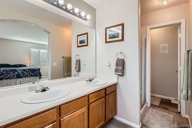 9615 Lansing Cir, Commerce City, CO 80022 - ensuite bathroom featuring a shower stall, double vanity, ensuite bathroom, and a sink