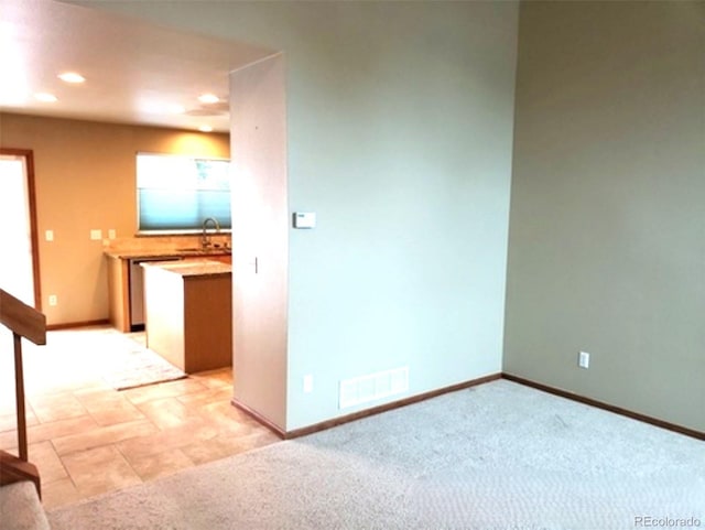 unfurnished room with light carpet, baseboards, visible vents, and recessed lighting