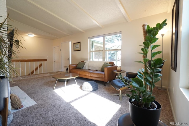 carpeted living room with lofted ceiling with beams and a textured ceiling