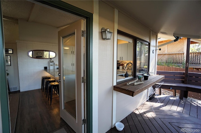 wooden terrace featuring sink