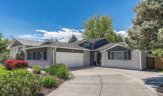 5071 S Boston St, Greenwood Village, CO 80111 - view of front of home featuring concrete driveway and a garage
