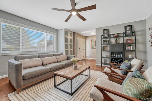 5071 S Boston St, Greenwood Village, CO 80111 - living area with ceiling fan, baseboards, and wood finished floors