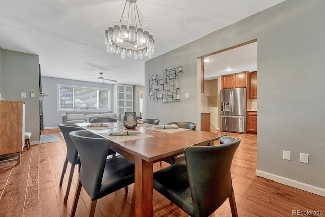 5071 S Boston St, Greenwood Village, CO 80111 - dining area featuring light wood-style floors, baseboards, a ceiling fan, and a chandelier