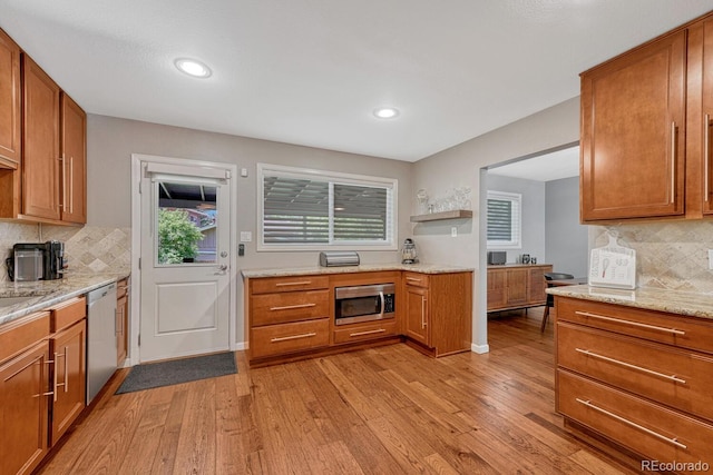 5071 S Boston St, Greenwood Village, CO 80111 - kitchen with appliances with stainless steel finishes, light wood-type flooring, tasteful backsplash, brown cabinetry, and recessed lighting
