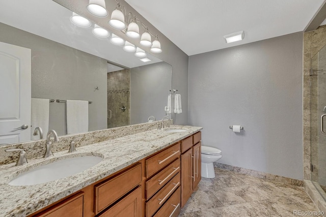 5071 S Boston St, Greenwood Village, CO 80111 - bathroom featuring a shower stall, toilet, double vanity, and baseboards