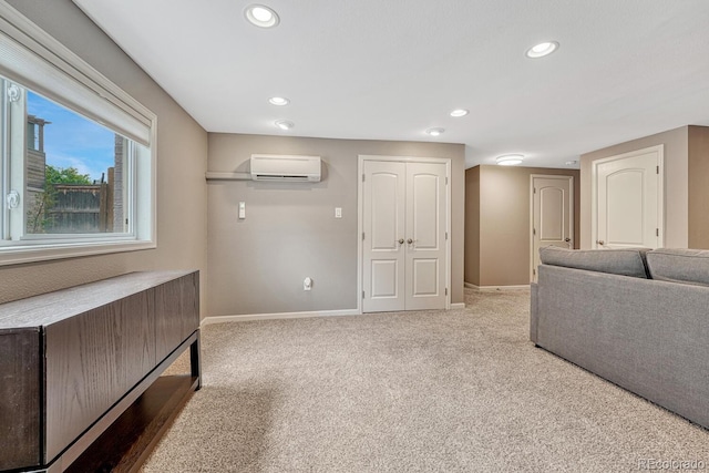 5071 S Boston St, Greenwood Village, CO 80111 - unfurnished living room featuring a wall unit AC, carpet floors, baseboards, and recessed lighting