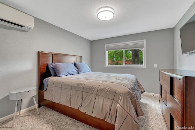 5071 S Boston St, Greenwood Village, CO 80111 - bedroom with a wall unit AC, light carpet, and baseboards