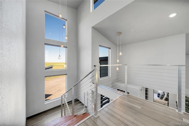 11680 Imboden Rd, Hudson, CO 80642 - hallway featuring an upstairs landing and wood finished floors